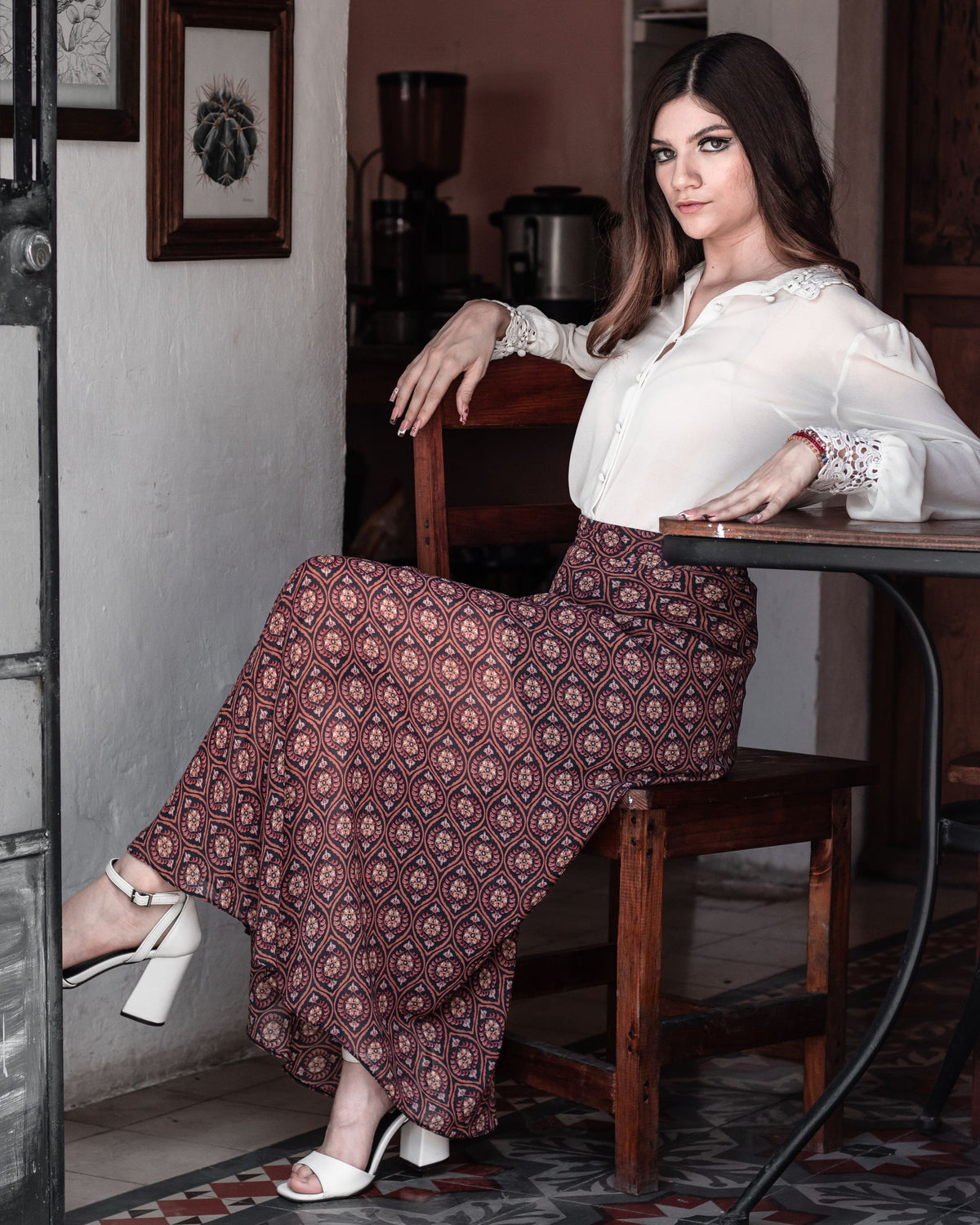 Woman wearing an elegant long skirt in a classic interior