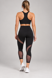Black mesh-panel capri leggings — back view