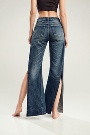 Dark indigo slit wide-leg jeans — back view