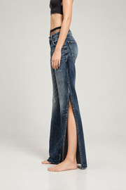 Dark indigo slit wide-leg jeans — side view