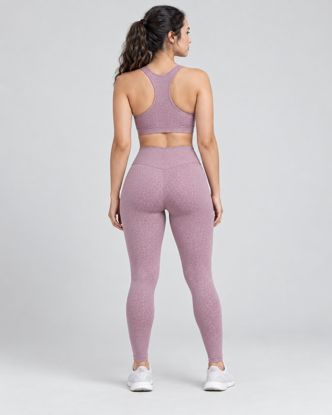 Dusty-rose patterned athletic leggings — back view