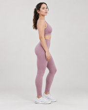 Dusty-rose patterned athletic leggings — side view