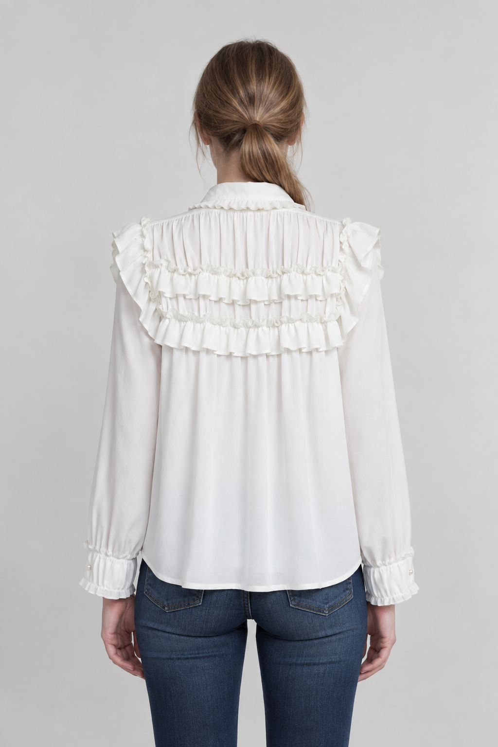 White ruffle blouse back view
